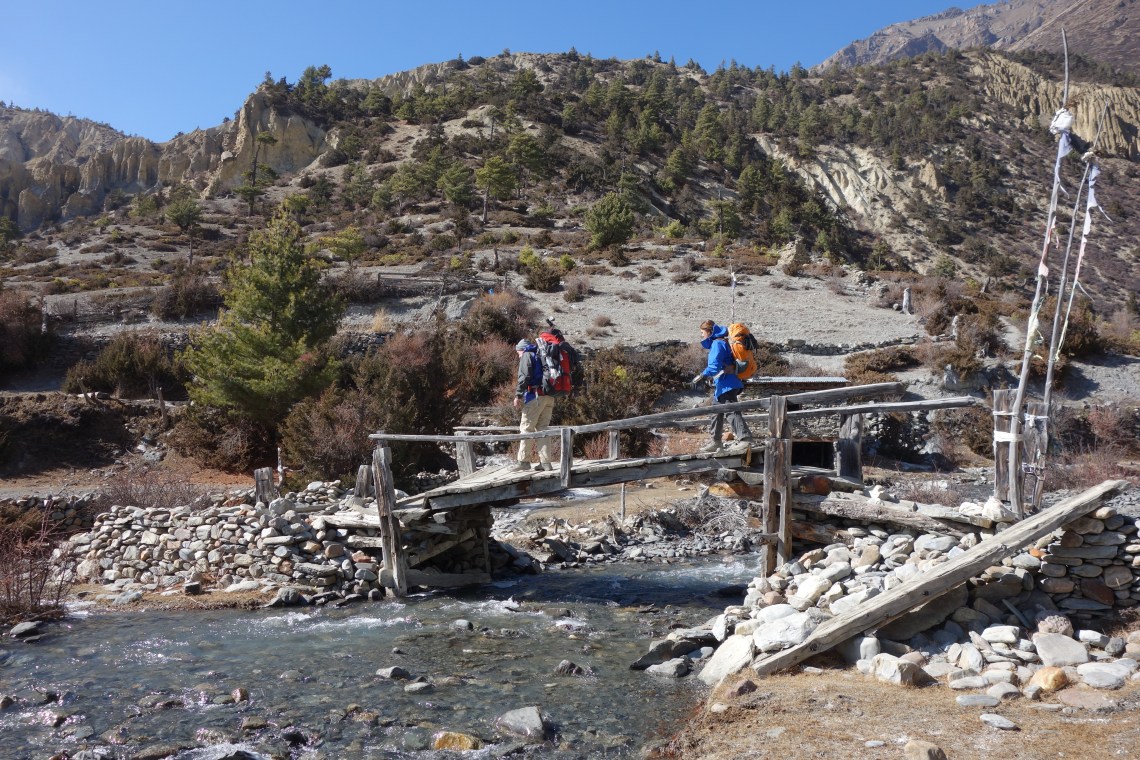 trekking in nepal river bridge travel blog