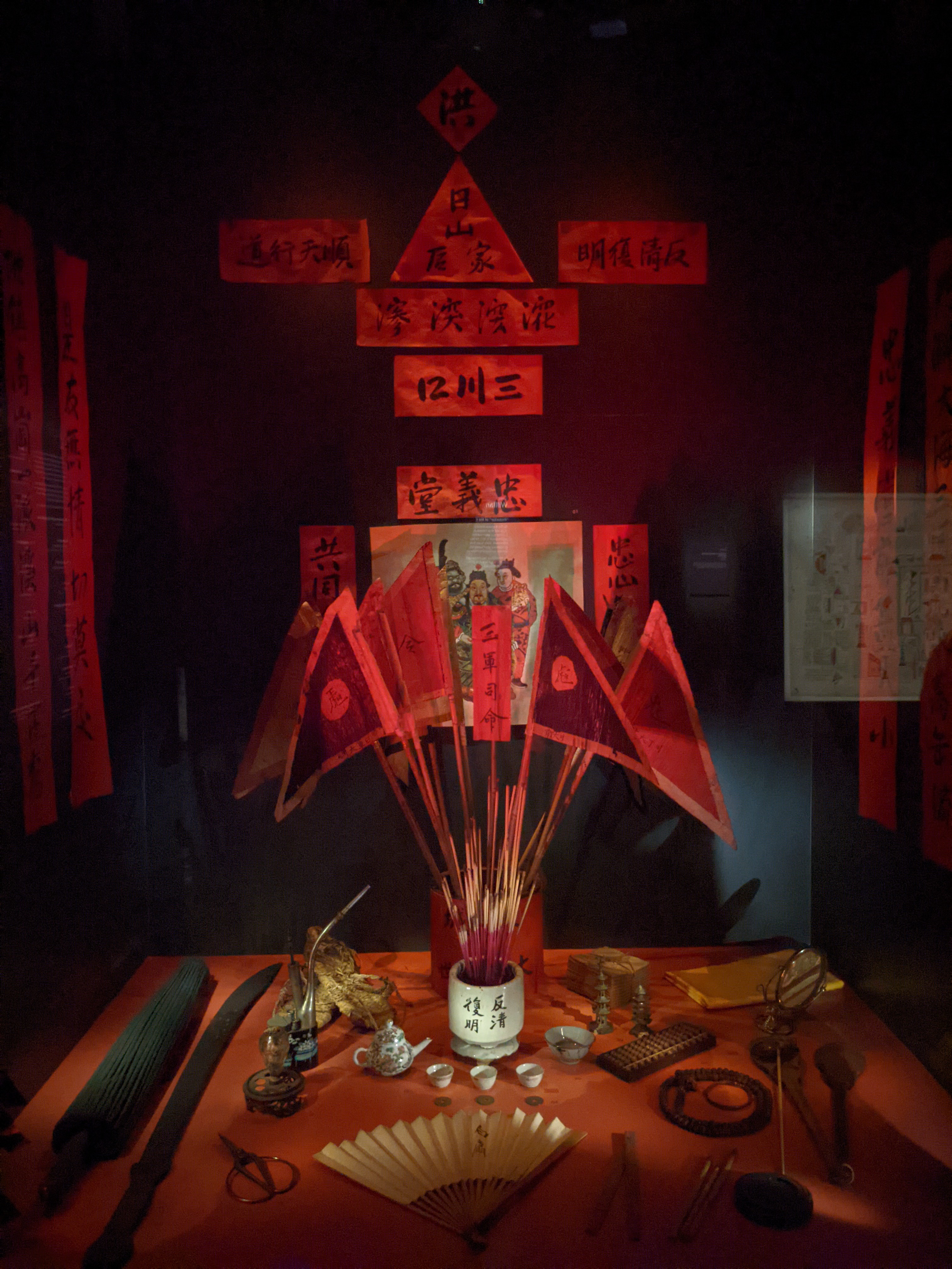 A display of old secret society paraphernalia at the National Museum of Singapore.