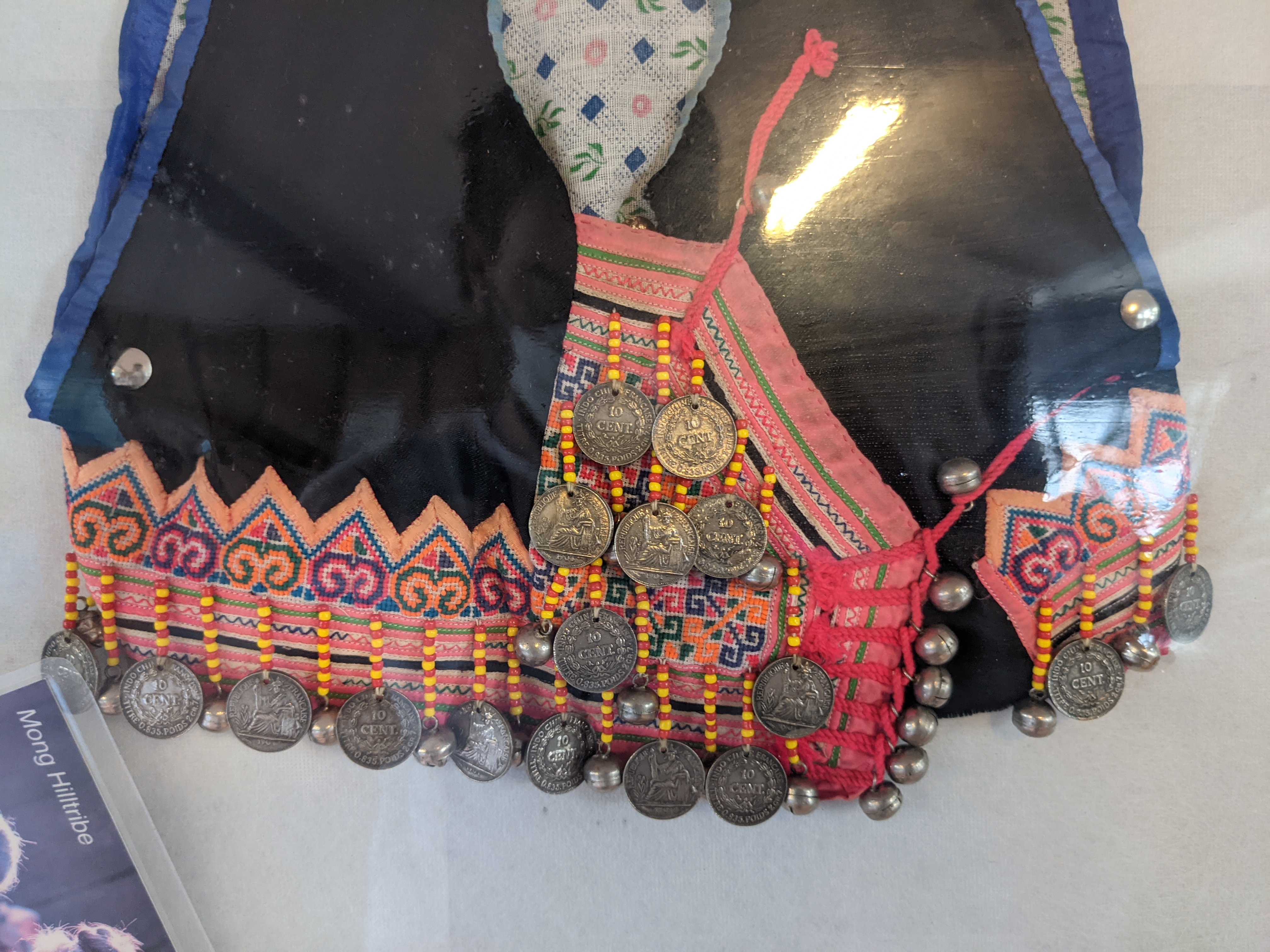 A piece of Akha clothing with coins from French Indochina attached as decorations. Other Akha women also use old imperial Chinese coins and old Indian rupees.